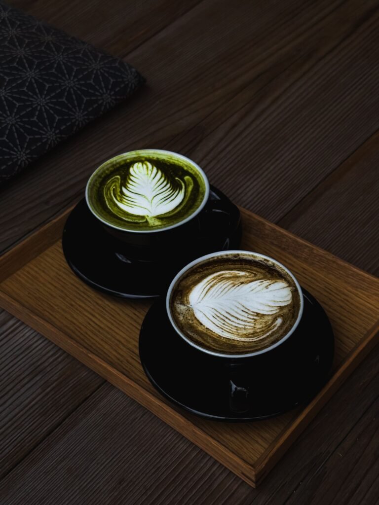 Matcha green tea and coffee cup comparison showing two popular caffeinated beverages